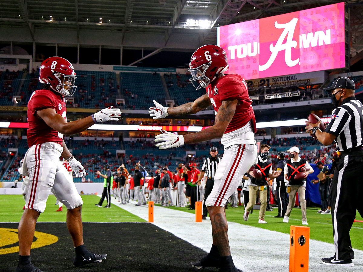 DeVonta Smith celebrates a touchdown with John Metchie III